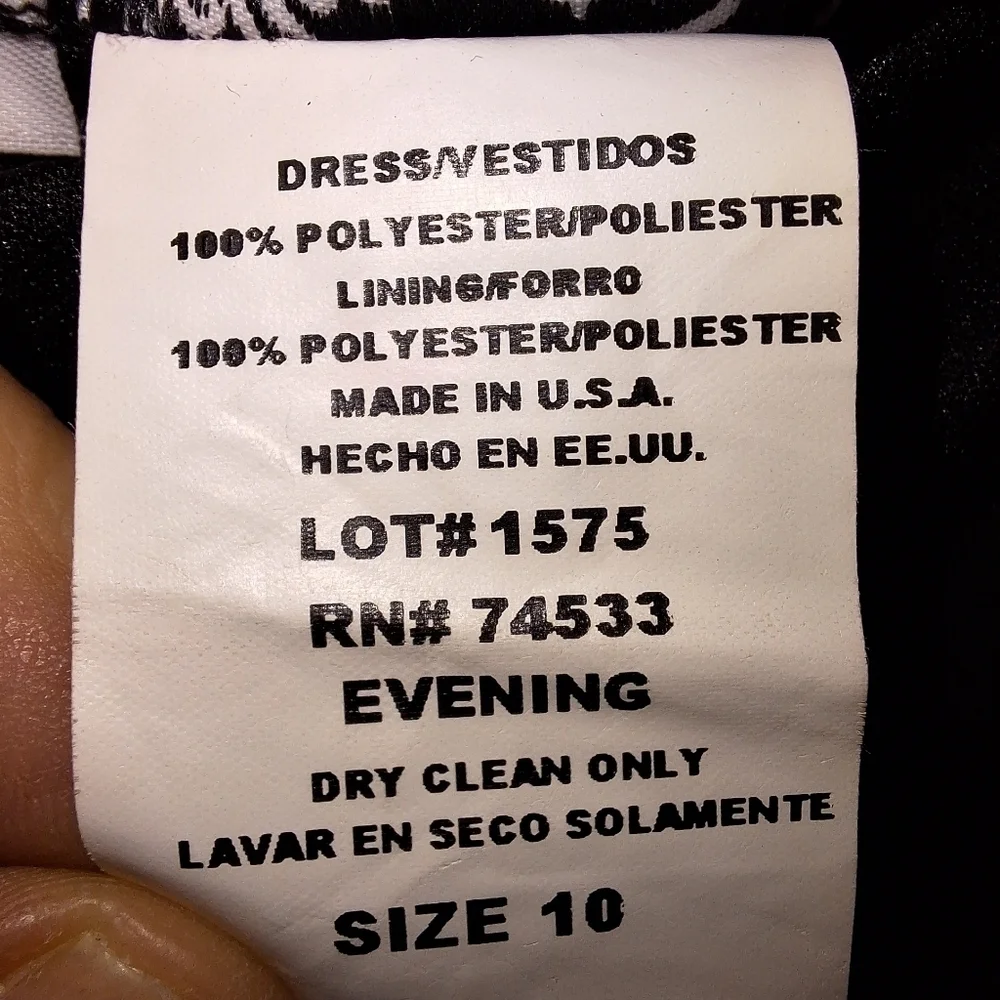 A Jeffrey and Dora asymmetrical Tiered black midi dress in a size 10. It's NWT.